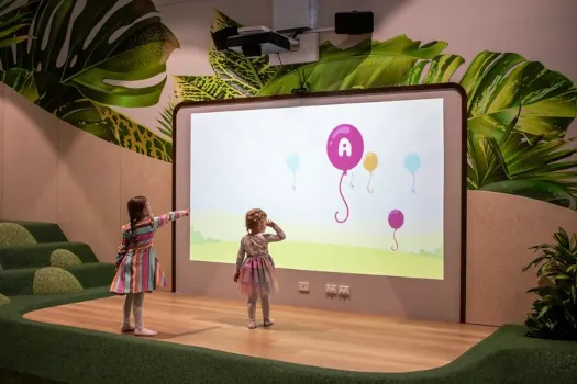 children playing with interactive wall display